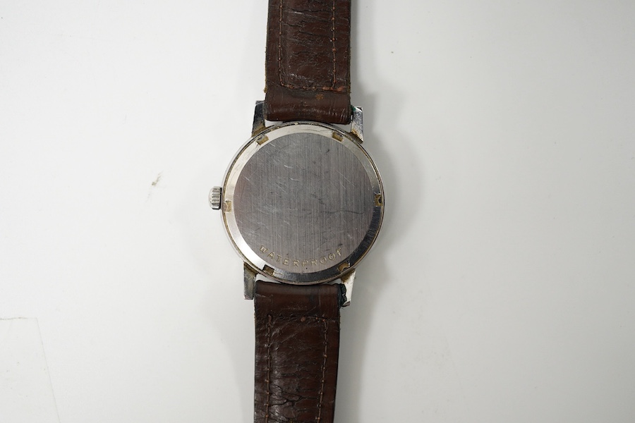 A gentleman's early 1970's stainless steel Omega manual wind wrist watch, on an associated leather strap, case diameter 35mm. Condition - poor to fair